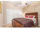 Comfortable bedroom with a large bed, ceiling fan, and a closet for ample storage space at 1945 W Desert Vista Trl # 77, Phoenix, AZ 85085