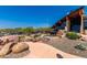 This angled view shows the architectural design of the community center and the outdoor rock landscaping at 1945 W Desert Vista Trl # 77, Phoenix, AZ 85085