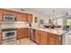 Kitchen featuring stainless steel appliances, granite countertops and adjacent dining area at 1945 W Desert Vista Trl # 77, Phoenix, AZ 85085