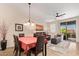 Living room with leather seating, decorative lighting, and an access door to the balcony at 1945 W Desert Vista Trl # 77, Phoenix, AZ 85085
