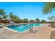 Enjoy swimming laps in the outdoor community pool, with a sunbathing and seating area at 1945 W Desert Vista Trl # 77, Phoenix, AZ 85085