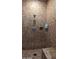 Tile shower with mounted soap dispensers and a shower seat at 1945 W Desert Vista Trl # 77, Phoenix, AZ 85085