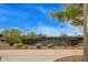 Well maintained community tennis courts with lighting for evening play and desert landscaping in the background at 1945 W Desert Vista Trl # 77, Phoenix, AZ 85085