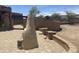 Spacious backyard with mountain views, hardscaped patio, fireplace, and low-maintenance landscaping at 20042 W Colter St, Litchfield Park, AZ 85340