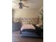 Bedroom with ceiling fan, pink blanket on bed, and decorative wallpaper border at 20042 W Colter St, Litchfield Park, AZ 85340