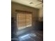 Bedroom features a large window with blinds and a decorative wall border at 20042 W Colter St, Litchfield Park, AZ 85340