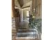 Inviting entryway with tiled flooring, brick accents, and a glimpse into the home's open layout at 20042 W Colter St, Litchfield Park, AZ 85340
