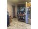 Inviting entryway with a wood table and stainless refrigerator at 20042 W Colter St, Litchfield Park, AZ 85340
