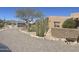 Stunning front yard with mature desert landscaping and a circular driveway at 20042 W Colter St, Litchfield Park, AZ 85340