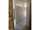 Hallway with tile floor, neutral paint, and decorative trim detail at 20042 W Colter St, Litchfield Park, AZ 85340