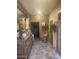 Hallway with decorative furniture and tiled floors at 20042 W Colter St, Litchfield Park, AZ 85340