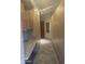 Hallway with storage and adjacent to closet with desk at 20042 W Colter St, Litchfield Park, AZ 85340