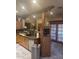 Kitchen with wooden cabinets, granite countertops, stainless steel appliances, and tiled floors at 20042 W Colter St, Litchfield Park, AZ 85340