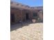 Brick-floored patio with exposed wood beams, easy access to living areas, and natural light at 20042 W Colter St, Litchfield Park, AZ 85340
