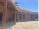 Expansive outdoor patio showcases exposed wood beams, brick flooring, and access to living spaces at 20042 W Colter St, Litchfield Park, AZ 85340