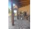 Charming covered brick patio with exposed wood beams and plenty of room to relax or entertain guests at 20042 W Colter St, Litchfield Park, AZ 85340