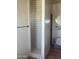 Walk-in shower features white tiling and a doorless entry in bathroom at 20042 W Colter St, Litchfield Park, AZ 85340