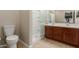 Bathroom featuring double sinks, a walk-in shower, and neutral colors at 20555 N 261St Ave, Buckeye, AZ 85396