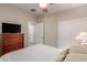 Cozy bedroom with closet, dresser, and neutral color palette offers comfort and functionality at 20555 N 261St Ave, Buckeye, AZ 85396
