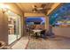 Charming covered patio with outdoor dining area, seamlessly blending indoor and outdoor living at 20555 N 261St Ave, Buckeye, AZ 85396