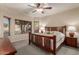 Relaxing main bedroom featuring a ceiling fan, neutral decor, and comfortable furnishing at 20555 N 261St Ave, Buckeye, AZ 85396
