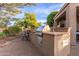 The outdoor kitchen area features a built-in grill and counter space, excellent for hosting summer barbecues at 20555 N 261St Ave, Buckeye, AZ 85396