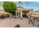 A gorgeous covered patio featuring a stone countertop bar and well-maintained brick pavers at 20555 N 261St Ave, Buckeye, AZ 85396