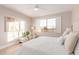 Bedroom featuring a large window with shutters, upholstered bed, and comfortable armchair at 20801 N 90Th Pl # 169, Scottsdale, AZ 85255