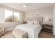 Bedroom featuring a large window, upholstered bed frame, and matching nightstands at 20801 N 90Th Pl # 169, Scottsdale, AZ 85255