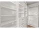 Spacious walk-in closet with custom shelving and drawers, perfect for organization at 20801 N 90Th Pl # 169, Scottsdale, AZ 85255