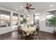 Bright dining area features large windows with views of the outside and dark hardwood flooring at 20801 N 90Th Pl # 169, Scottsdale, AZ 85255