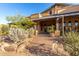 Attractive home entrance with desert landscaping and stone accents at 20801 N 90Th Pl # 169, Scottsdale, AZ 85255