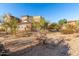 Charming exterior showcasing desert landscaping surrounding a well-maintained, tan-colored home at 20801 N 90Th Pl # 169, Scottsdale, AZ 85255