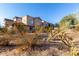 Exterior of the home showing desert landscaping and a home with a gorgeous clay tile roof at 20801 N 90Th Pl # 169, Scottsdale, AZ 85255