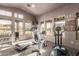Community fitness center features modern equipment and large windows overlooking the pool at 20801 N 90Th Pl # 169, Scottsdale, AZ 85255