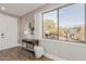 Bright foyer with a window, desk, and decor creates a welcoming first impression at 20801 N 90Th Pl # 169, Scottsdale, AZ 85255