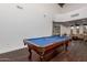 Bright game room features a billiard table with hardwood floors and great natural light at 20801 N 90Th Pl # 169, Scottsdale, AZ 85255
