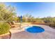 Community hot tub area with lounge chairs, providing a serene and relaxing space at 20801 N 90Th Pl # 169, Scottsdale, AZ 85255
