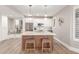Bright modern kitchen features stainless appliances, white cabinets, and an island with stools at 20801 N 90Th Pl # 169, Scottsdale, AZ 85255