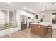 Bright, modern kitchen offers stainless appliances, white cabinets, and an island with seating at 20801 N 90Th Pl # 169, Scottsdale, AZ 85255