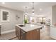 Modern kitchen includes stainless appliances, white cabinets, and an island with barstool seating at 20801 N 90Th Pl # 169, Scottsdale, AZ 85255