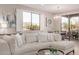 Bright living room featuring a sectional sofa, stylish decor, and a lovely chandelier at 20801 N 90Th Pl # 169, Scottsdale, AZ 85255