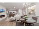 Bright living room view showcases open floor plan, modern fireplace, adjacent kitchen and dining area at 20801 N 90Th Pl # 169, Scottsdale, AZ 85255