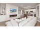 Bright living room view includes fireplace, TV, and comfy seating in an open floor plan design at 20801 N 90Th Pl # 169, Scottsdale, AZ 85255