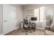 Bright home office featuring modern desk, ergonomic chair, and outdoor access at 20801 N 90Th Pl # 169, Scottsdale, AZ 85255
