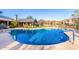 Community pool featuring blue water, ample deck space, and covered seating areas at 20801 N 90Th Pl # 169, Scottsdale, AZ 85255