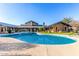 Community pool boasting blue water, ample deck space, and covered seating areas at 20801 N 90Th Pl # 169, Scottsdale, AZ 85255