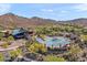 Aerial view of community recreation center, pool, and play areas with mountain views at 2118 W Hunter Ct # 136, Phoenix, AZ 85085