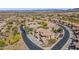This aerial shot showcases a community featuring desert landscaping and well-maintained streets at 2118 W Hunter Ct # 136, Phoenix, AZ 85085