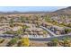 An aerial view of the beautiful, well-maintained community with mountain views in the background at 2118 W Hunter Ct # 136, Phoenix, AZ 85085